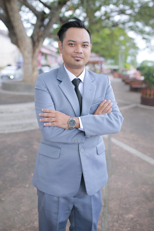 Formal outdoor portrait of Mohammad Hafiz bin Ismail